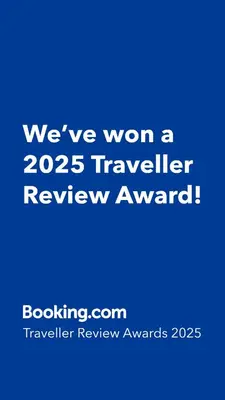 a blue sign that says weve won a traveler review award at ZAYN Phrom Phong Hotel in Bangkok