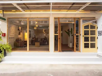 a sliding glass door of a house with a living room at 2 Bedroom apartment at Silom with city center view - 5A in Bangkok