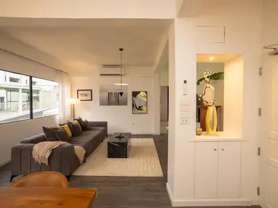 a living room with a couch and a table at 2-Bedroom Penthouse in the heart of Silom - 4A in Bang Rak