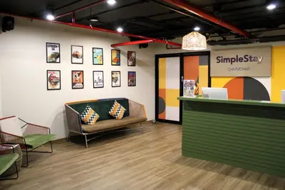 a waiting room with a couch and a counter at SimpleStay Chatuchak, SureStay Collection by Best Western in Bangkok