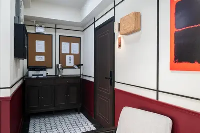 a room with a door and a sink in it at Boutique hotel Axis Bangkok in Bangkok