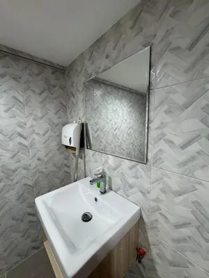 a bathroom with a sink and a mirror at Twenty Two Place Hostel - Sukhumvit 22 in Bangkok