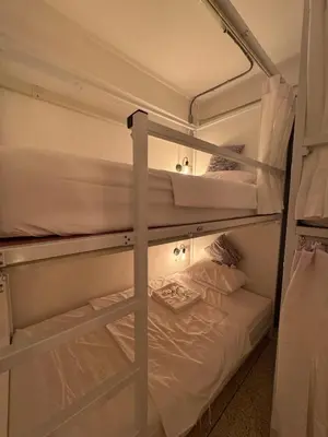 a couple of bunk beds in a room at Twenty Two Place Hostel - Sukhumvit 22 in Bangkok