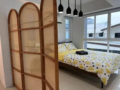 a bedroom with a bed and a wooden bunk bed at hana villa in Bangkok