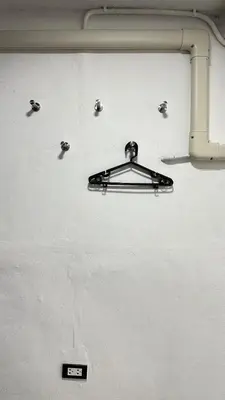 a metal object is hanging on a wall at Megun 10 L in Bangkok