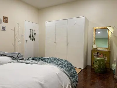 a bedroom with a bed and a mirror at Nordic Townhouse FIT Group - 800M MRT Huaykwang in Bangkok