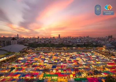 a large parking lot full of umbrellas at sunset at Nordic Townhouse FIT Group - 800M MRT Huaykwang in Bangkok