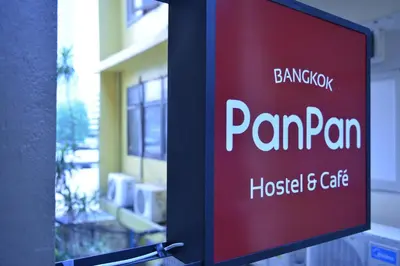 a sign that reads pandan hospital and cafe at PanPan Hostel in Bangkok