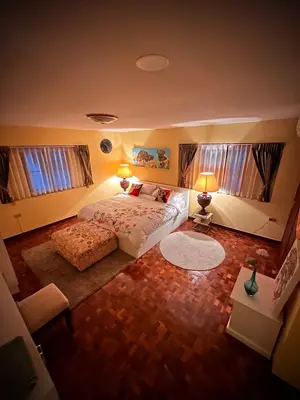 a bedroom with a large bed and two windows at Newly-renovated Modern Private Thai Villa with Swimming Pool in Ban Khlong Samrong