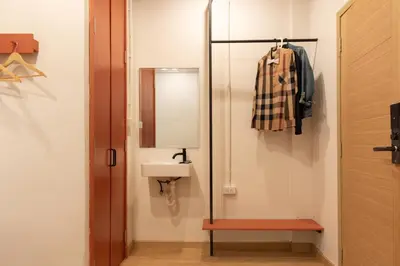a bathroom with a sink and a mirror at Samyan Story Boutique Hotel in Bangkok