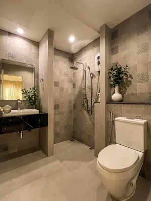 a bathroom with a toilet and a sink and a shower at Vanilla house in Nonthaburi