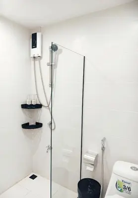 a shower with a glass door in a bathroom at Fivehouse Silom1 - City heart - Silom -BTS MRT 2min - lumpini park - bnh in Bangkok