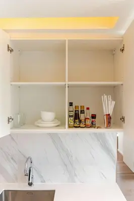 a kitchen with a sink and a counter top at Pet Friendly Modern Nest Asoke in Bangkok
