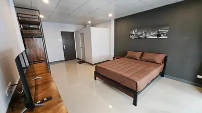 a bedroom with a bed in a room at Smile Home โรงแรม ห้องพัก รายวัน รายเดือน in Ban Zong Katiam