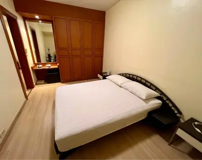 a bedroom with a bed in a room with a bathroom at Riverside room with best view in heart of BKK in Godown