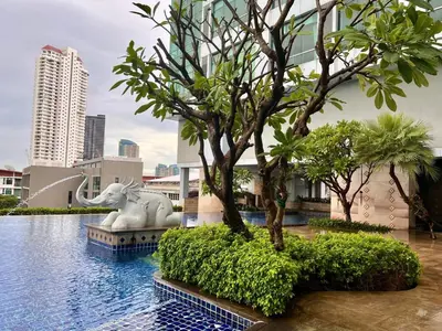 a statue of an elephant in the middle of a pool at Riverside room with best view in heart of BKK in Godown