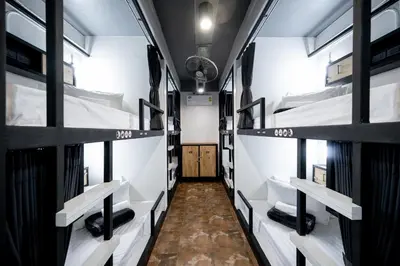 a room with four bunk beds in it at Vibes Hostel Bangkok in Bangkok