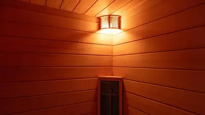 a light in a room with a wooden wall at Shine Sukhumvit 33 Aparthotel Phrompong in Bangkok