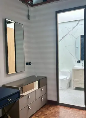 a bathroom with a sink and a mirror and a toilet at Brown Brick Thonglor - Green Greenery Room in Bangkok