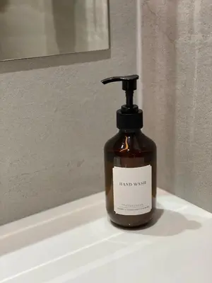 a bottle of liquid soap sitting on a bathroom sink at THE CELESTRAIL - Apartment - Check-In by Appointment Only - Non-hotel - Onnut BTS in Bangkok
