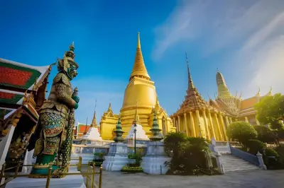 a temple with a statue in front of it at XX GO INN Khaosan The Grand Palace Bangkok in Bangkok