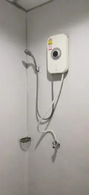 a water hose is attached to a wall at XX GO INN Khaosan The Grand Palace Bangkok in Bangkok