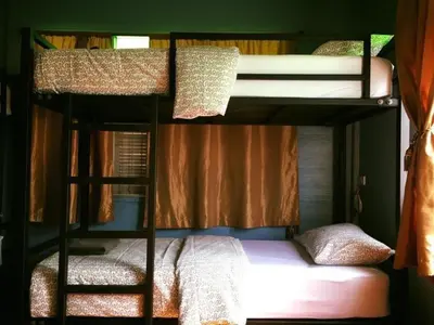 a couple of bunk beds in a room at Blue Chang House in Bangkok