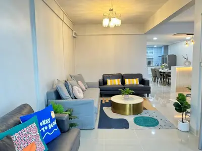 a living room with two couches and a table in it at MIQ HK256 5BR MRT Ratchada and HuaiKhwang in Bangkok
