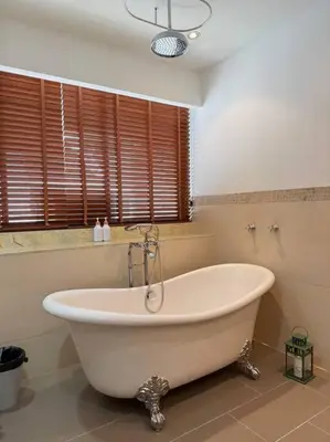 a large white bath tub in a bathroom at Miq Asoke 5BR Sukhuvit15 in Makkasan