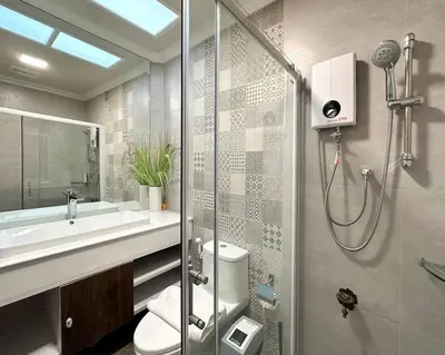 a bathroom with a shower and a toilet and a sink at MIQ Rama9 Villa 3Br in City Jodd fair MRT in Makkasan