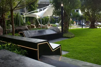 a park with benches and a skate park with a slide at Close to onnut bts condo in Bangkok