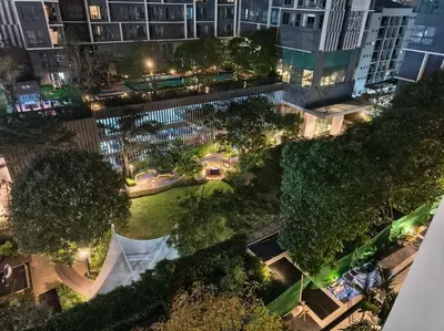 an overhead view of a park at night with buildings at Close to onnut bts condo in Bangkok