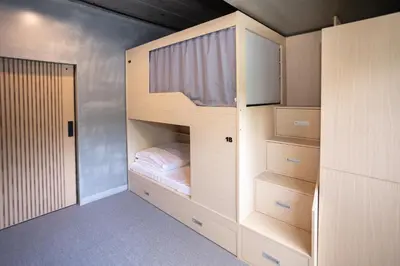 a bedroom with a bunk bed with a bunk bed at DMK Place in Bangkok