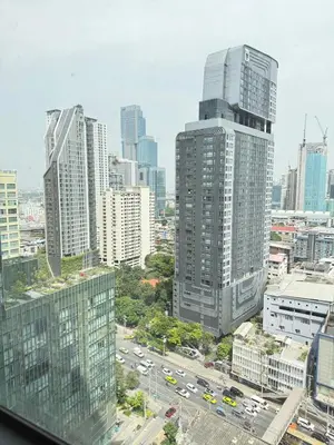 a view of a city with tall buildings and traffic at Brand New Condo in Bangkok