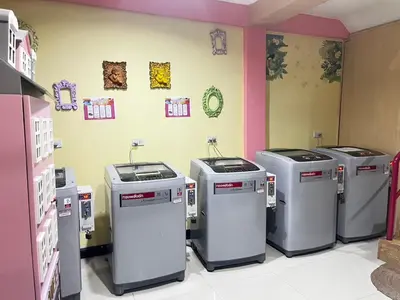 a row of four trash cans in a room at BB Boutique Sathorn in Bangkok