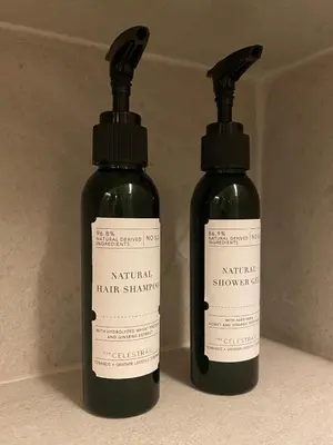 two bottles of hair shampoo sitting next to each other at The Celestrail - Apartment - Check-In by Appointment Only - Non-hotel - Onnut BTS in Amphoe Phra Khanong