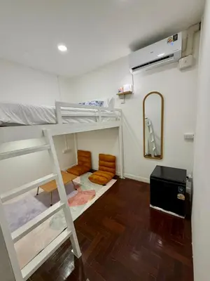 a room with two bunk beds and a mirror at Comfy Crib Hostel 2 in Bangkok