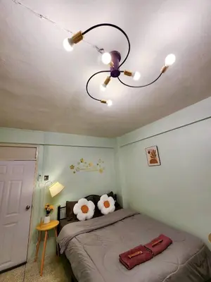 a bedroom with a bed with a ceiling fan at 803-STP Homely room Free Wi-Fi and Near BTS line in Bangkok