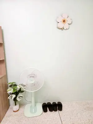 a white table with a white fan and some shoes at 803-STP Homely room Free Wi-Fi and Near BTS line in Bangkok