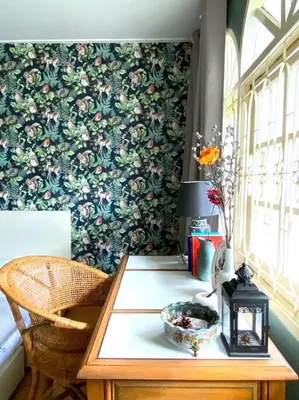 a room with a table with a flowery wallpaper at Entire House 6 people 3Beds 2Baths near BTS Asoke Terminal21 in Bangkok