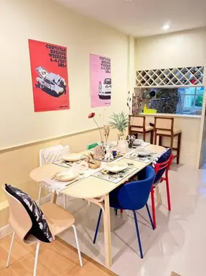 a dining room with a table with blue chairs at Entire House 6 people 3Beds 2Baths near BTS Asoke Terminal21 in Bangkok