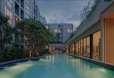 a large swimming pool in the middle of a building at Luxury and cozy apartment in the City center in Bangkok