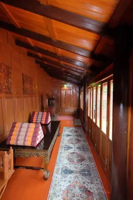 a train car with two couches in a room at เรือนไทยพราวพิมาน Proudpiman Thai Heritage House in Ban Bang Toei (1)