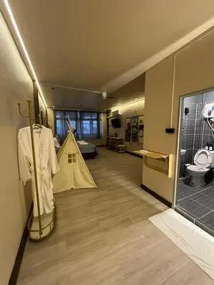 a room with a tent in the middle of a room at Moochi Relax L'Assommior in Bangkok