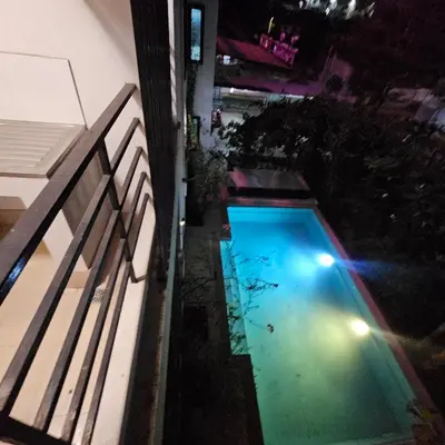an overhead view of a swimming pool at night at bang khun thian14 in Sathani Wat Sing