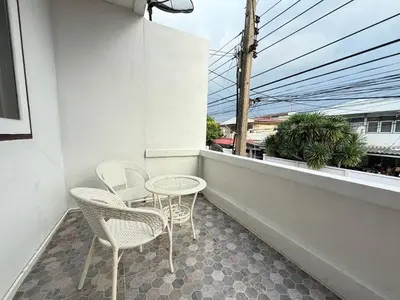 a patio with two chairs and a table on a balcony at 10MIN \u66fc\u8c37\u72ec\u680bChatuchack,Kasetsart\u7cbe\u54c1\u522b\u5885 MYSTORY HOUSE in Bangkok