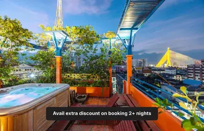 an extra room on a balcony with a hot tub at Collection O Diamond House Khaosan in Bangkok