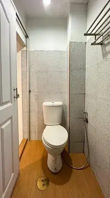 a bathroom with a white toilet in a room at Chubbi 5 Room10 in Bang O