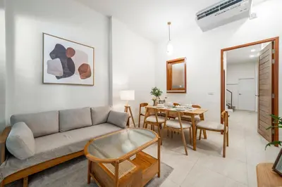 a living room with a couch and a table at 4BR Walk to Chinatown, MRT Luggage Dropoff in Bangkok