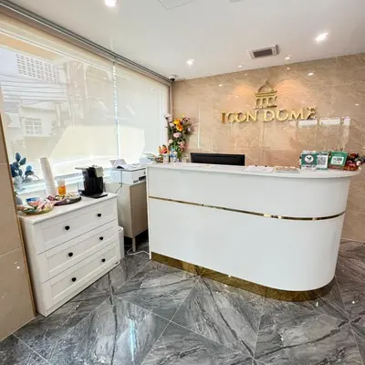 a kitchen with a white counter and a white dresser at Icon Dome Bangkok in Bangkok
